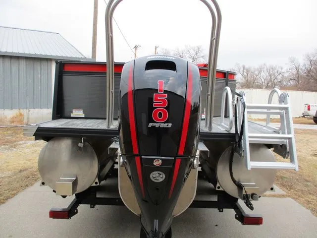 Slide: The Image of Rear view of a 2023 Qwest E 824 Splash RW EXT LTZ TT II boat. - 2