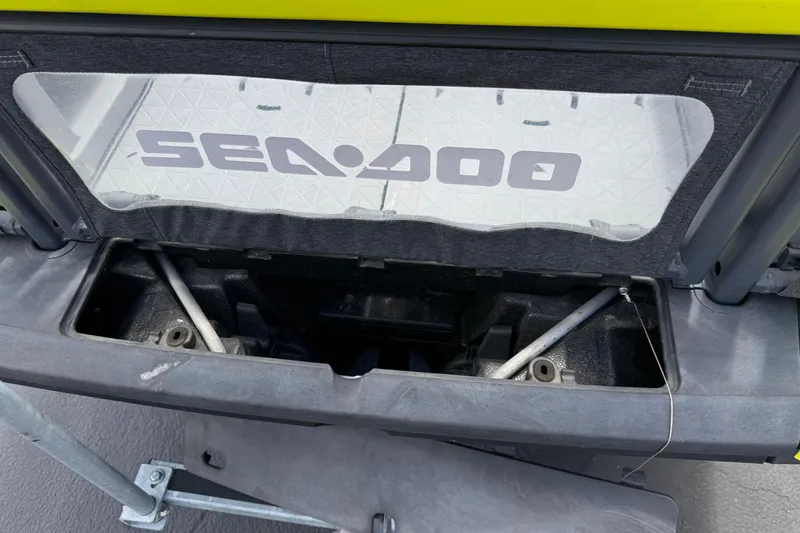 Slide: The Image of 2023 Sea-Doo Switch Cruise 18 storage compartment with logo visible. - 11