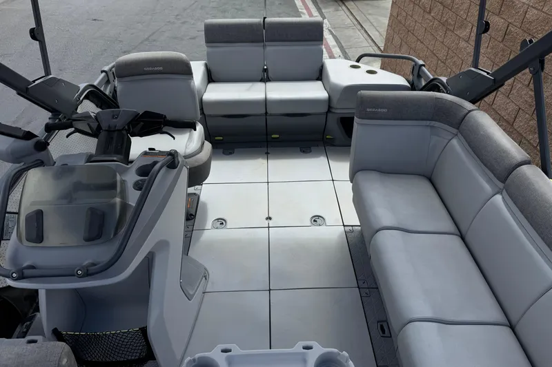 Slide: The Image of 2023 Sea-Doo Switch Cruise 18 interior with spacious seating and modern helm design. - 16