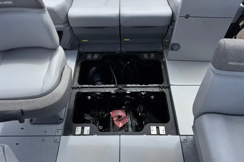 Slide: The Image of 2023 Sea-Doo Switch Cruise 18 interior showing under-seat storage compartments. - 18