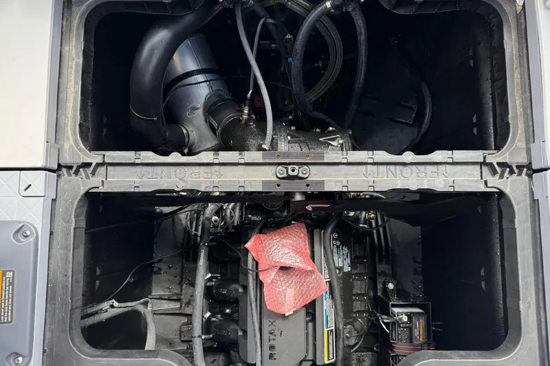 Slide: The Image of Engine compartment of 2023 Sea-Doo Switch Cruise 18, showcasing internal components and wiring. - 19