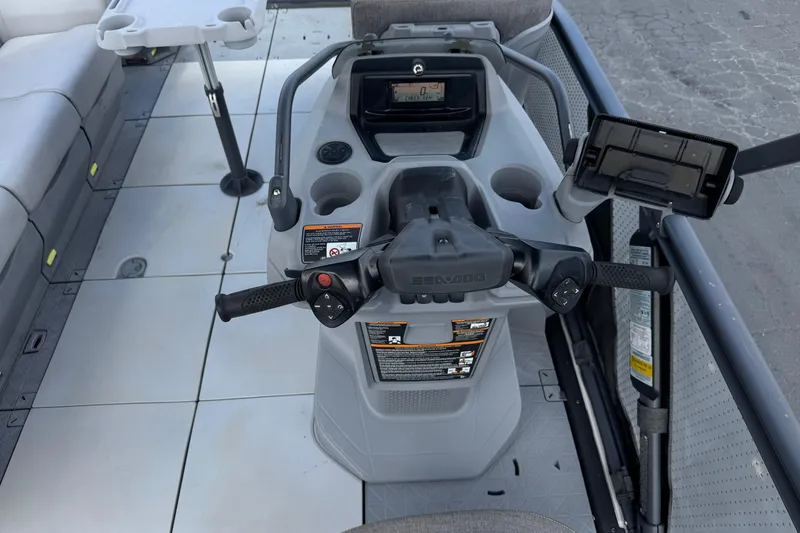 Slide: The Image of 2023 Sea-Doo Switch Cruise 18 dashboard with steering controls and seating area. - 21