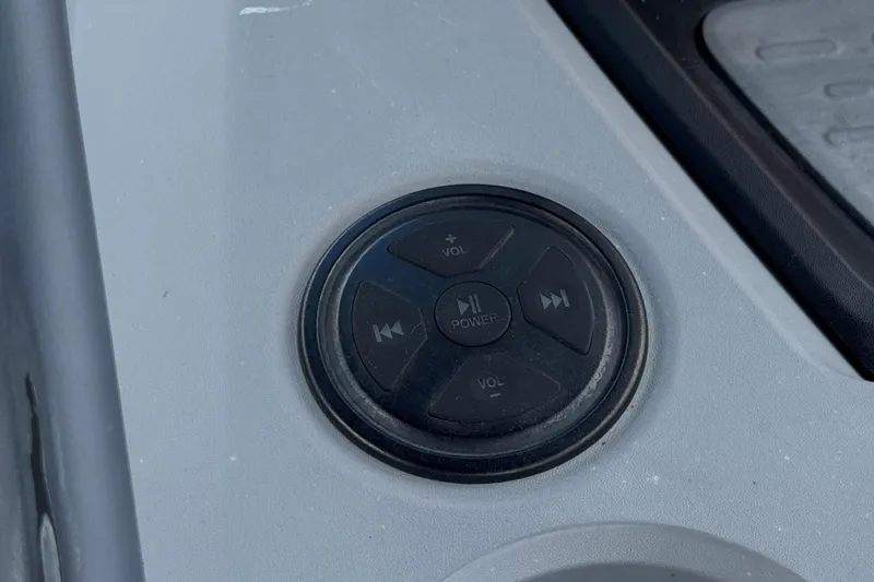 Slide: The Image of Control panel on 2023 Sea-Doo Switch Cruise 18, featuring volume and power buttons. - 22