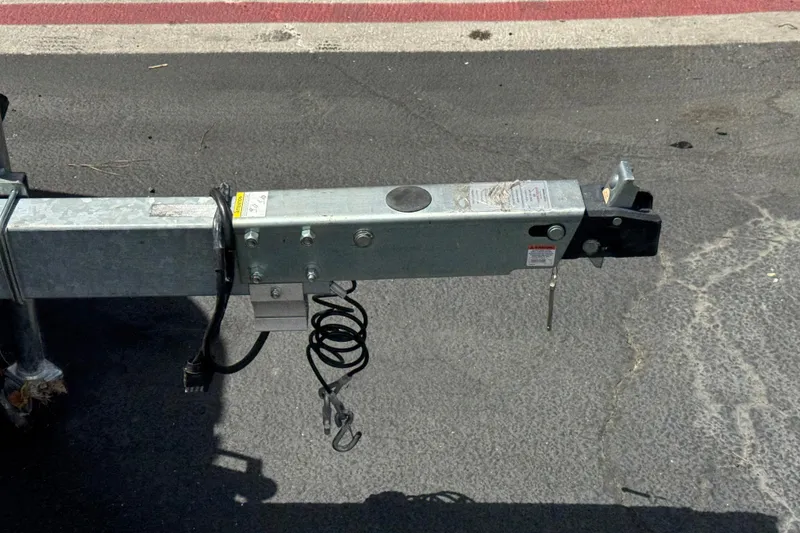 Slide: The Image of Trailer hitch of a 2023 Sea-Doo Switch Cruise 18 on asphalt pavement. - 25