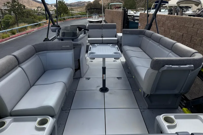Slide: The Image of 2023 Sea-Doo Switch Cruise 18 interior with spacious seating and table setup. - 9