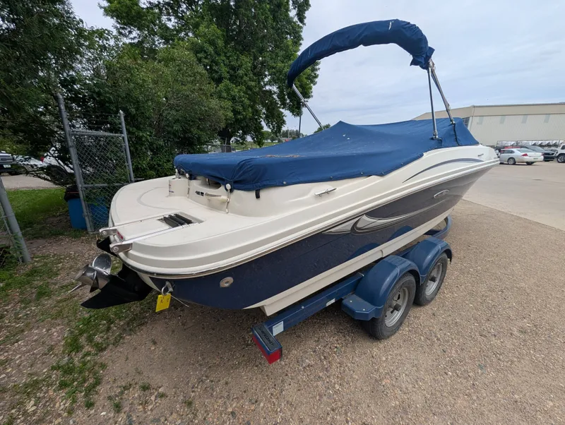 Slide: The Image of 2010 Sea Ray 205 Sport boat on trailer, blue cover. - 4