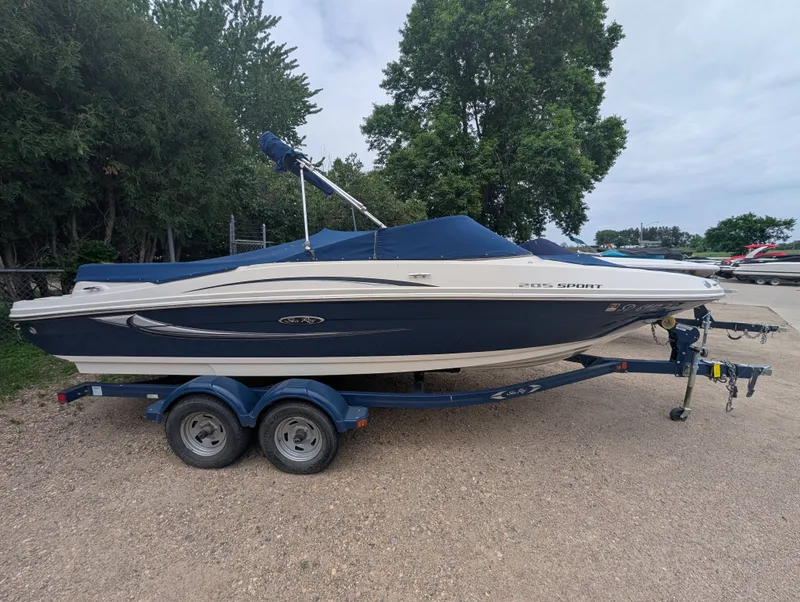 Slide: The Image of 2010 Sea Ray 205 Sport boat on trailer, side view. - 5