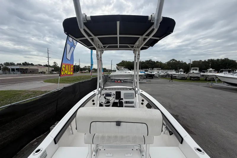 Slide: The Image of 2018 Yamaha Boats 190 FSH for sale at a dealership, overcast sky. - 18