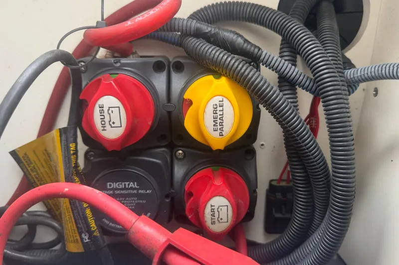 Slide: The Image of 2018 Yamaha Boats 190 FSH electrical panel with switches and wiring. - 21