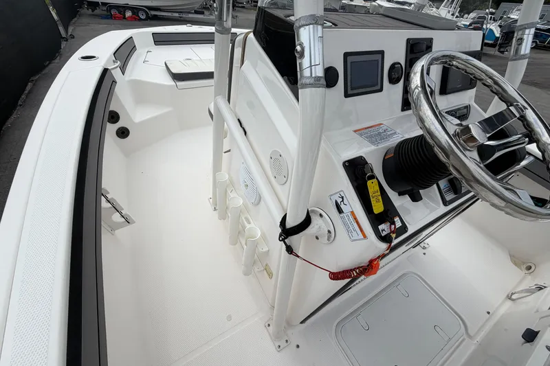 Slide: The Image of 2018 Yamaha Boats 190 FSH interior with steering wheel and control panel. - 31