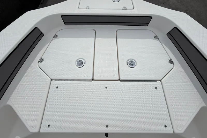 Slide: The Image of 2018 Yamaha Boats 190 FSH deck with storage compartments and seating. - 34