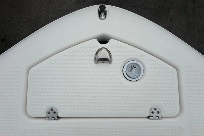 Slide: The Image of 2018 Yamaha Boats 190 FSH bow storage compartment with latch and cleat. - 38