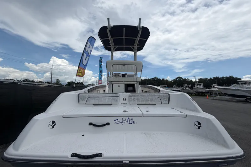 Slide: The Image of 2018 Yamaha Boats 190 FSH displayed at a boat sale event under cloudy skies. - 4
