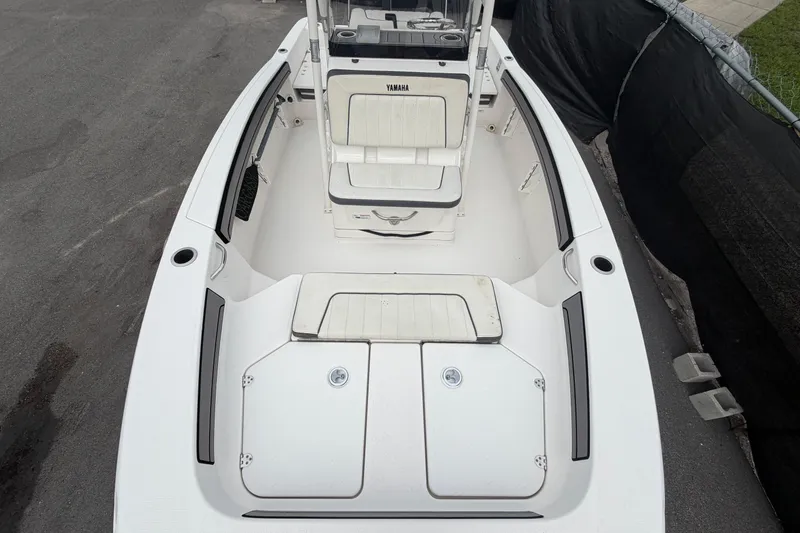 Slide: The Image of 2018 Yamaha Boats 190 FSH interior view, showcasing seating and storage compartments. - 40
