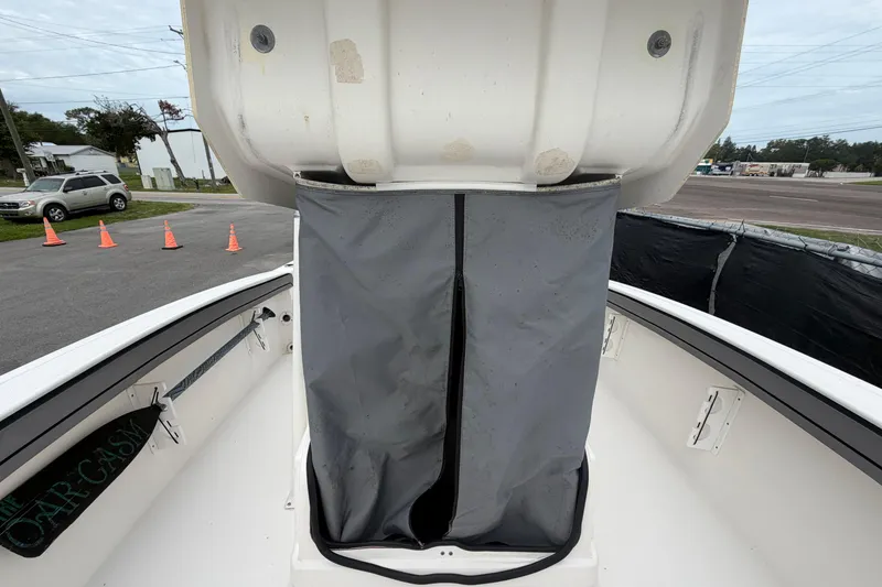 Slide: The Image of 2018 Yamaha Boats 190 FSH interior with storage compartment, parked outdoors. - 44