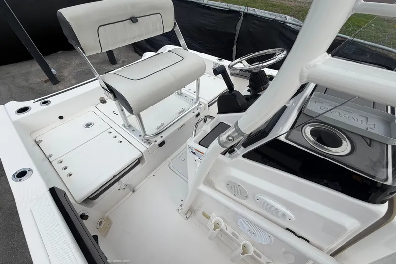 Slide: The Image of 2018 Yamaha Boats 190 FSH interior with steering wheel and seating. - 47