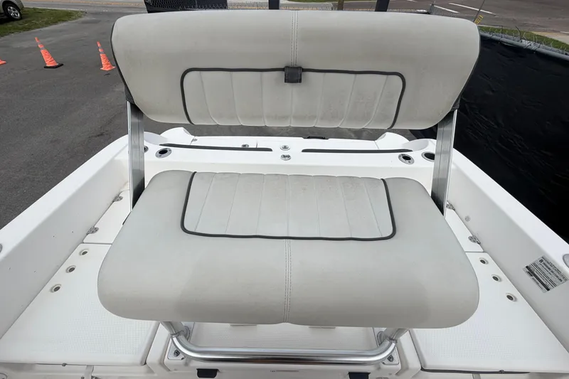 Slide: The Image of 2018 Yamaha Boats 190 FSH seat with white upholstery and metal frame. - 54