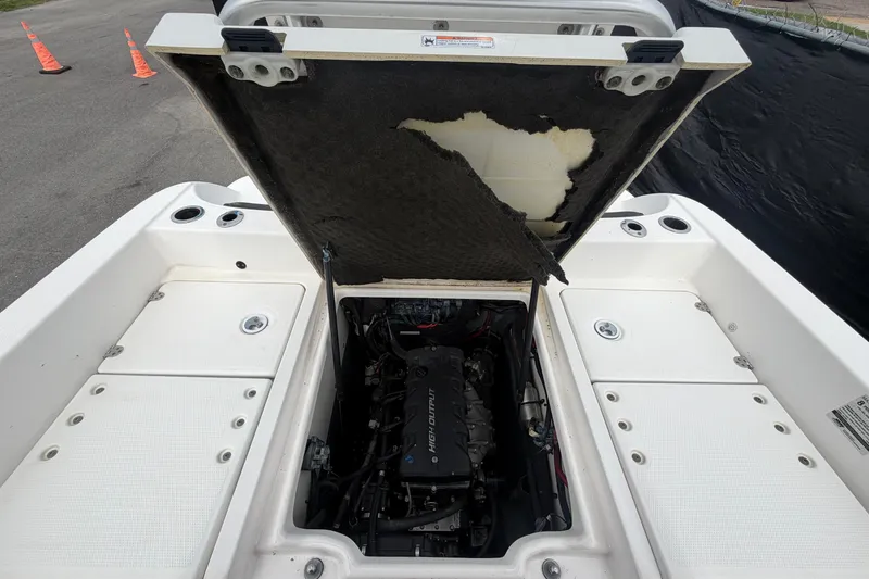 Slide: The Image of Open engine compartment of 2018 Yamaha Boats 190 FSH, showcasing internal components. - 55