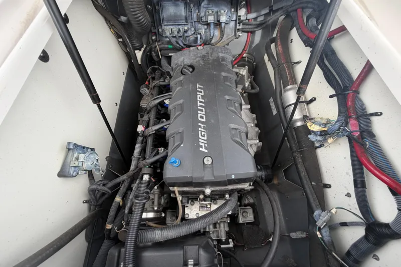 Slide: The Image of Engine compartment of a 2018 Yamaha Boats 190 FSH, showcasing high output engine components. - 56