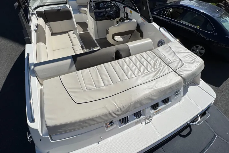 Slide: The Image of 2018 Bayliner 195 Deck Boat interior with spacious seating and modern dashboard. - 1