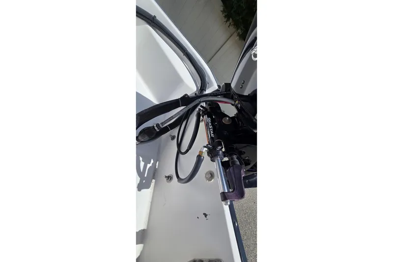 Slide: The Image of 2004 Boston Whaler 150 Sport boat steering mechanism and hydraulic system detail. - 7