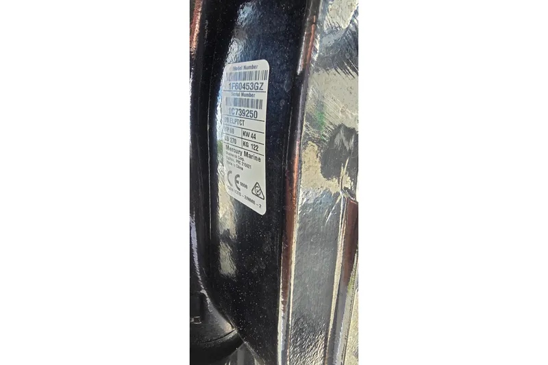 Slide: The Image of Label on a 2004 Boston Whaler 150 Sport boat, displaying model and serial numbers. - 8