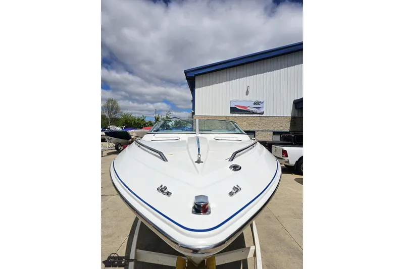 Slide: The Image of 1997 Formula 252 SS boat displayed outdoors under a cloudy sky. - 12