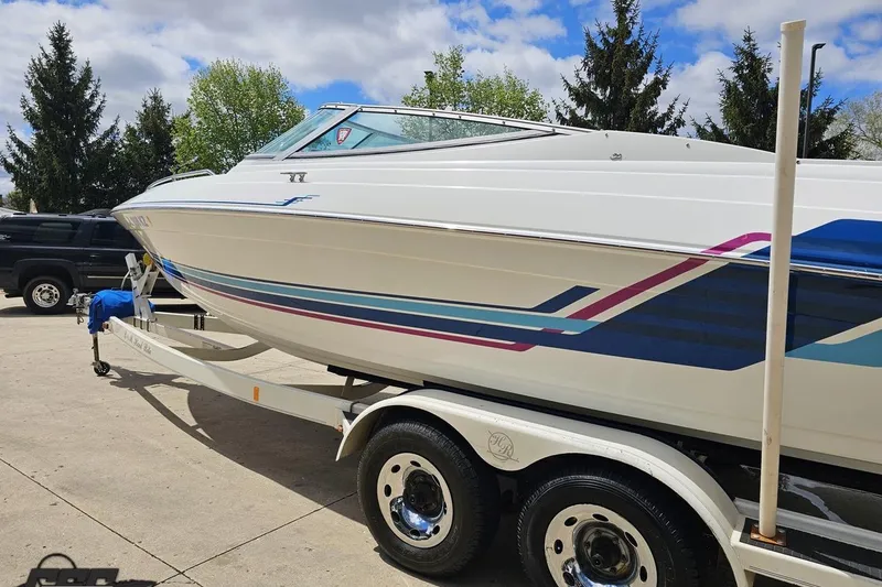 Slide: The Image of 1997 Formula 252 SS boat on trailer, featuring sleek design and colorful graphics. - 23
