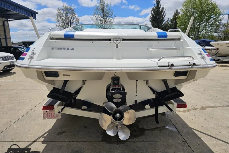 Slide: The Image of Rear view of a 1997 Formula 252 SS boat with dual propellers. - 27