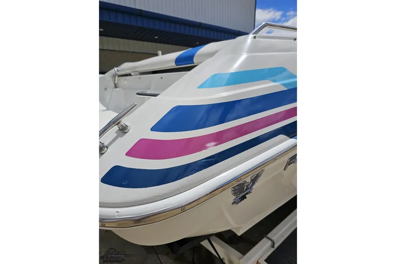 Slide: The Image of 1997 Formula 252 SS boat with colorful stripes and sleek design. - 33