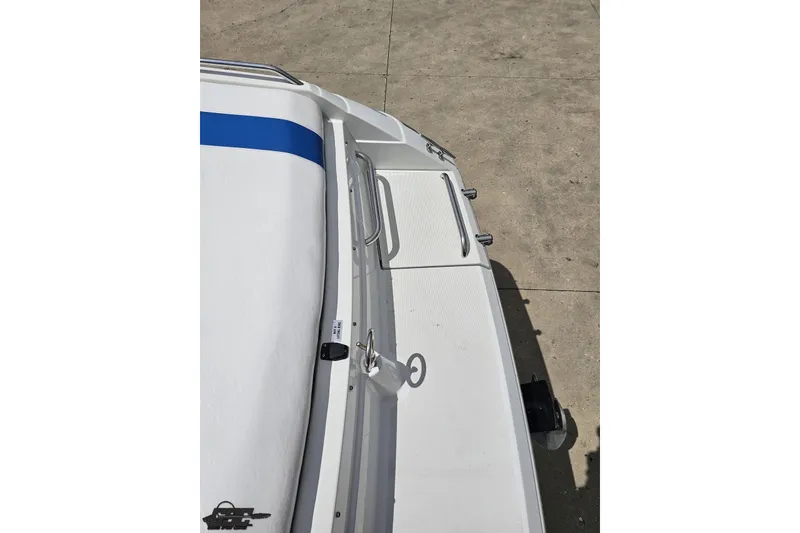 Slide: The Image of 1997 Formula 252 SS boat deck with blue stripe and stainless steel railings. - 34