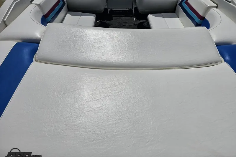 Slide: The Image of White leather seating on a 1997 Formula 252 SS boat with blue and red accents. - 42