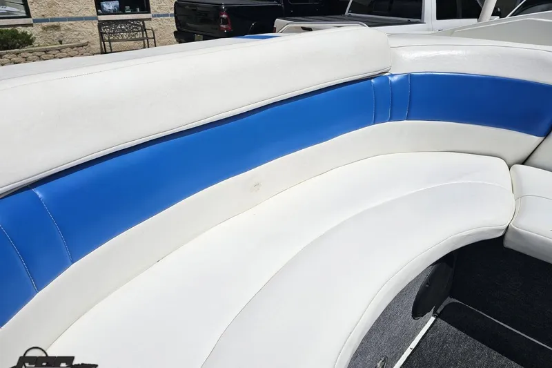 Slide: The Image of 1997 Formula 252 SS boat interior with blue and white seating. - 50