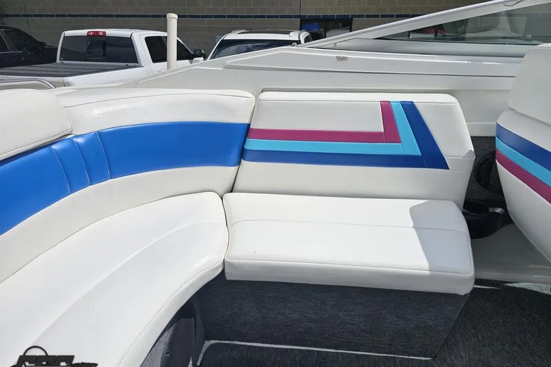 Slide: The Image of Interior seating of a 1997 Formula 252 SS boat with colorful upholstery design. - 51