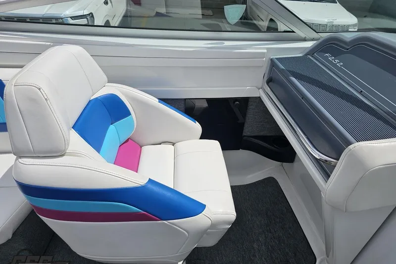 Slide: The Image of Interior of a 1997 Formula 252 SS boat with colorful seating. - 53