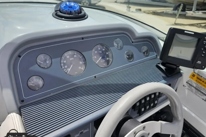 Slide: The Image of Dashboard of a 1997 Formula 252 SS boat with gauges and navigation equipment. - 64