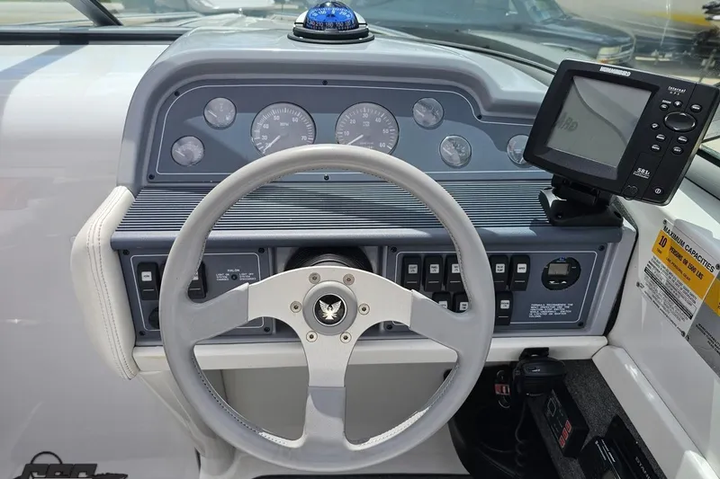 Slide: The Image of Steering console of a 1997 Formula 252 SS boat with gauges and navigation equipment. - 65