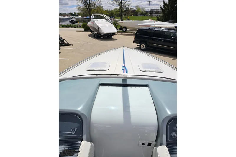 Slide: The Image of 1997 Formula 252 SS boat parked, viewed from the bow, with other boats in the background. - 69