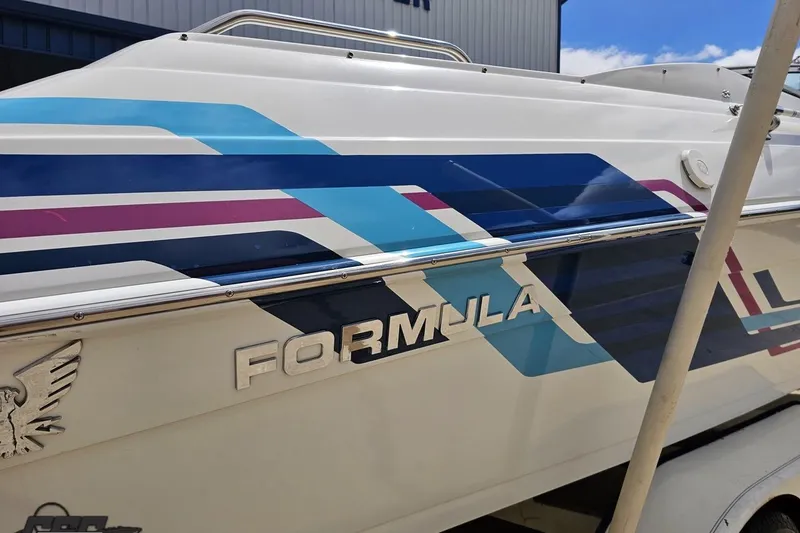 Slide: The Image of 1997 Formula 252 SS boat with colorful graphics and logo on the side. - 7
