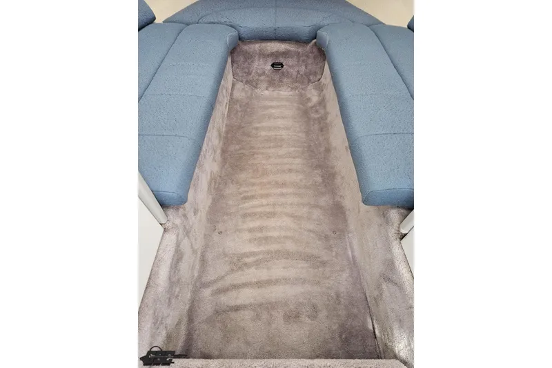 Slide: The Image of Interior of a 1997 Formula 252 SS boat with blue seating and carpeted flooring. - 73