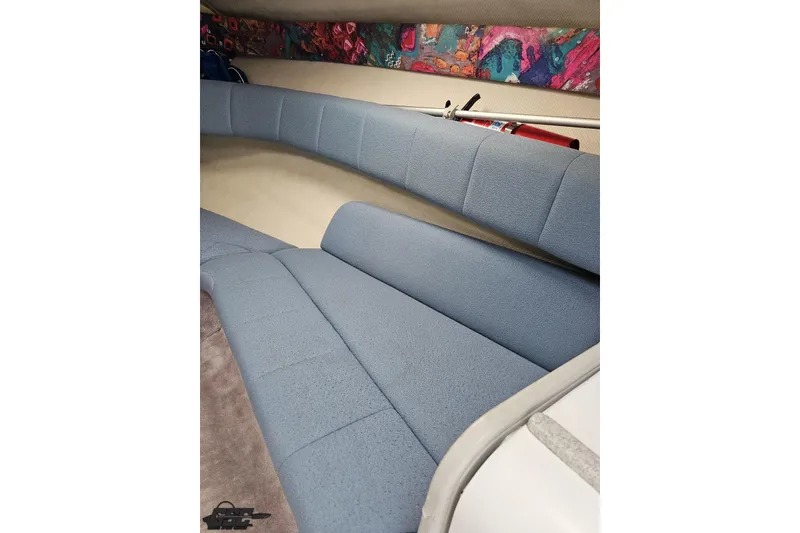 Slide: The Image of Interior seating of a 1997 Formula 252 SS boat with blue upholstery. - 74