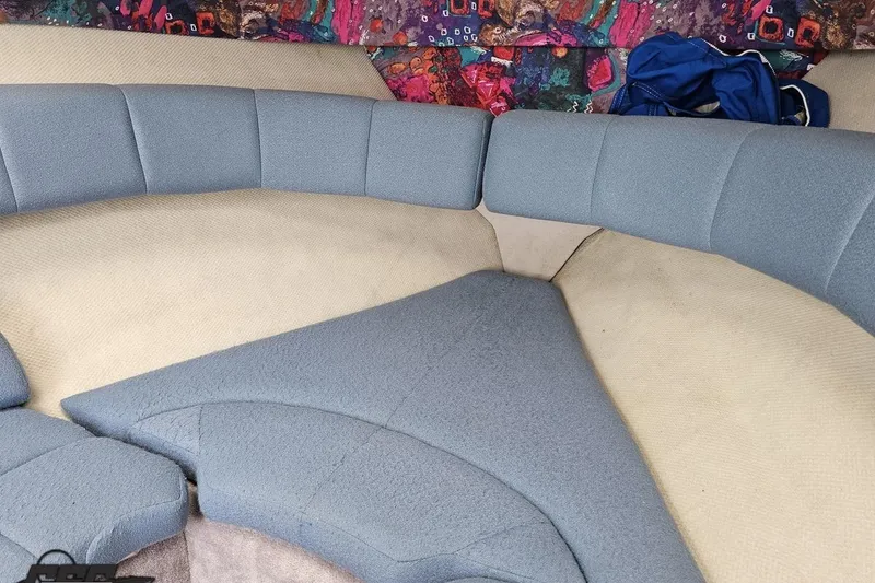Slide: The Image of Interior seating of a 1997 Formula 252 SS boat with colorful upholstery. - 78