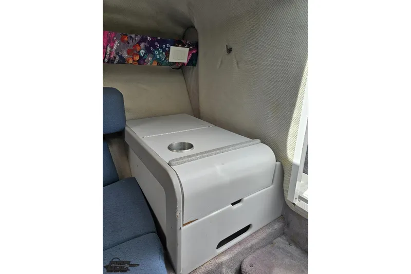 Slide: The Image of Interior of a 1997 Formula 252 SS boat with seating and storage compartment. - 81