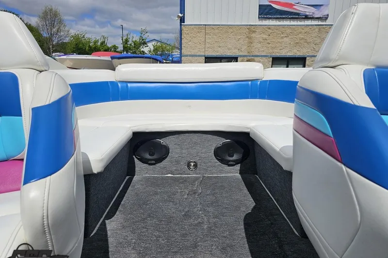 Slide: The Image of Interior of a 1997 Formula 252 SS boat with colorful seating and speakers. - 85