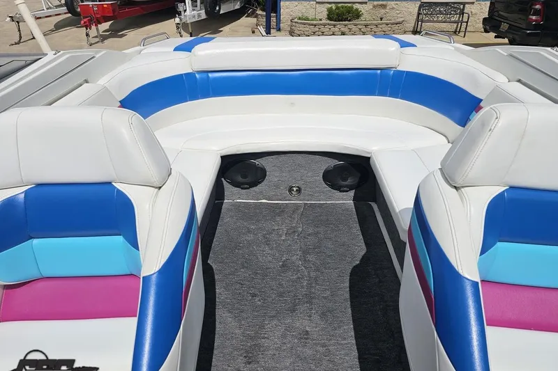 Slide: The Image of 1997 Formula 252 SS boat interior with colorful seating and carpeted floor. - 86