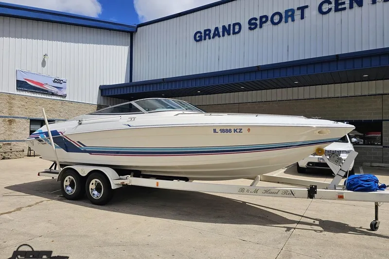 Slide: The Image of 1997 Formula 252 SS boat on trailer at Grand Sport Center dealership. - 9