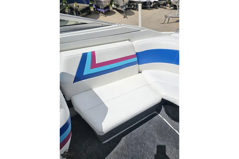 Slide: The Image of 1997 Formula 252 SS boat interior with colorful striped seating. - 90