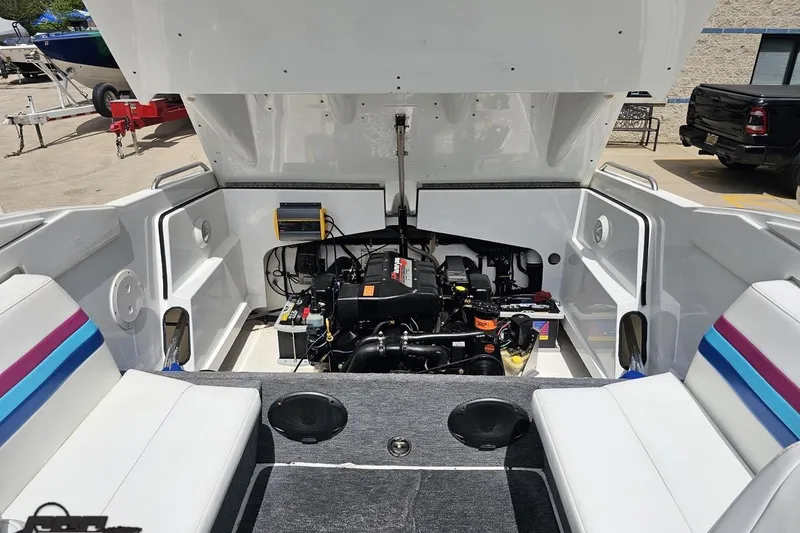 Slide: The Image of Engine compartment of a 1997 Formula 252 SS boat with open hatch and seating. - 97