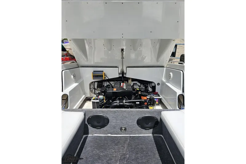 Slide: The Image of 1997 Formula 252 SS boat engine compartment with open hatch, showcasing engine details. - 98