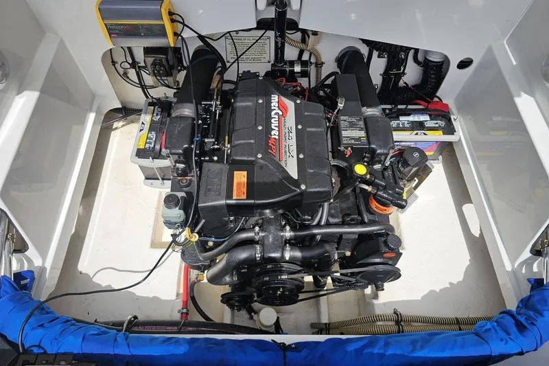 Slide: The Image of Engine compartment of a 1997 Formula 252 SS boat, featuring a MerCruiser 7.4L engine. - 99